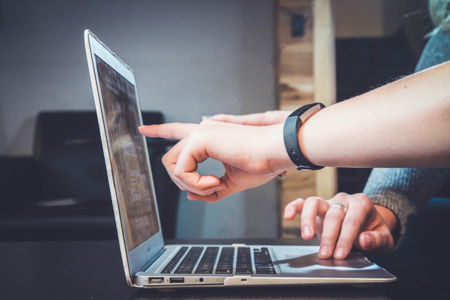 Person updating software on a laptop for app maintenance
