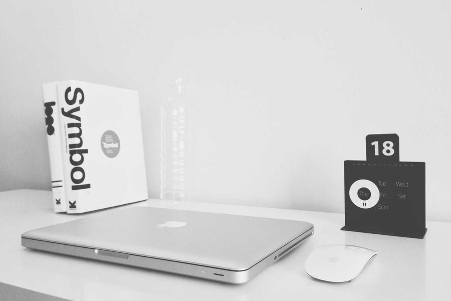 Notebook with project schedule and sticky notes
